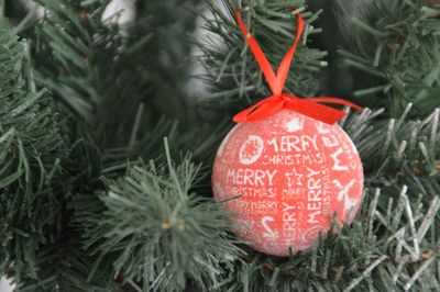 Close-up of christmas decorations hanging on tree