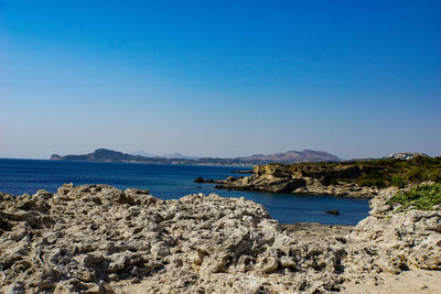 Scenic view of sea against clear blue sky