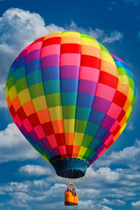 Low angle view of hot air balloons against sky