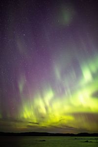 Scenic view of sea against sky at night