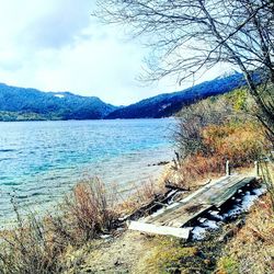 Scenic view of lake with mountains in background