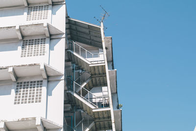 Low angle view of buildings against blue sky