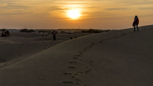 Woman standing on desert
