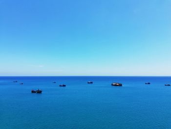 Scenic view of sea against clear blue sky