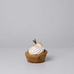 Close-up of cake on white background