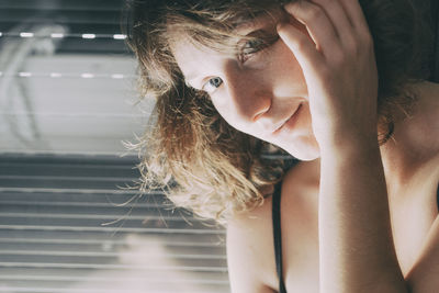 Close-up portrait of a girl looking away at home