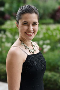 Close-up portrait of smiling young woman