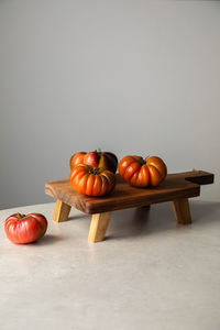 Composition with red tomatoes on table