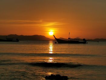 Scenic view of sea against orange sky