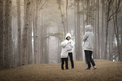 People standing in forest