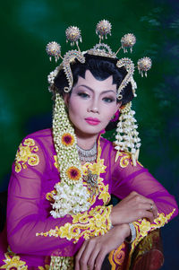 Portrait of young woman with bouquet