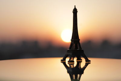 Close-up of tower against sky during sunset