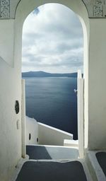 Scenic view of sea against sky seen through window