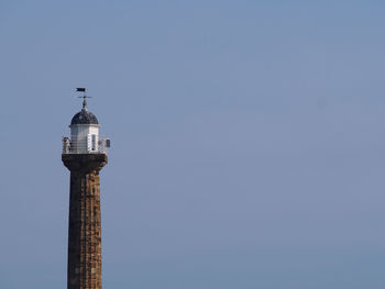 Low angle view of tower against clear blue sky