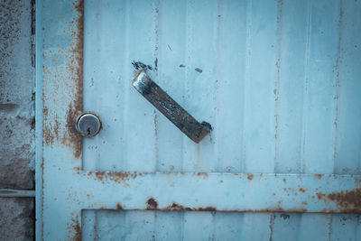 Close-up of old blue metal door