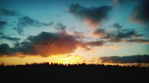 Scenic view of landscape against cloudy sky