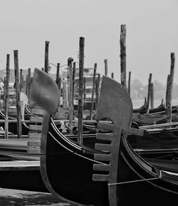 Boats moored in canal against clear sky