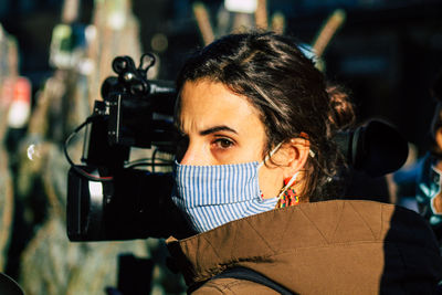 Portrait of woman photographing