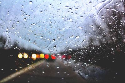 Raindrops on glass window during rainy season