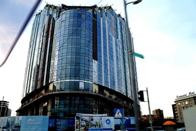 Low angle view of modern building against sky