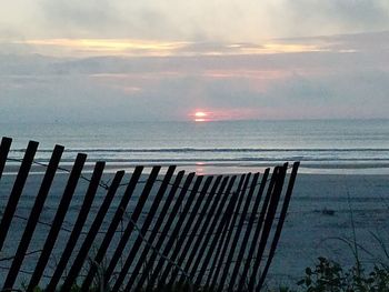 Scenic view of sea against sky at sunset