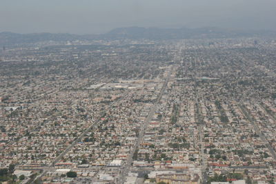 Aerial view of cityscape against sky