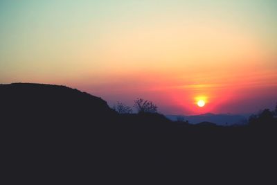 Scenic view of sunset over mountains