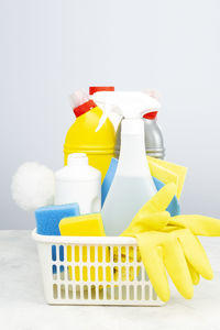 Close-up of yellow bottle against white background