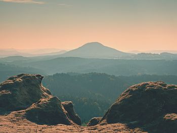 Scenic view of mountains against sky during sunset