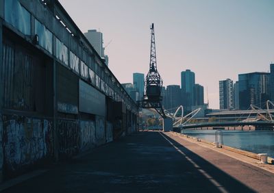 Street amidst buildings against sky in city