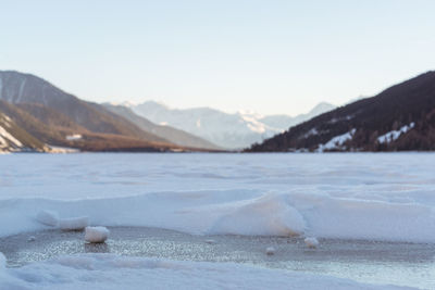 Scenic view of frozen lake against sky