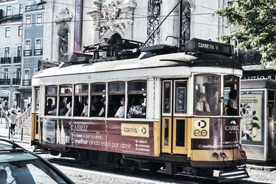 Train on railroad tracks in city