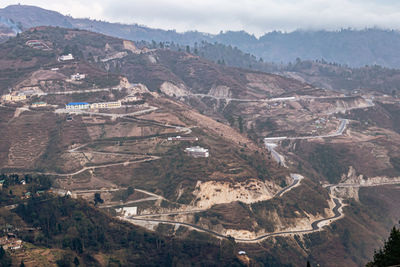 Mountain curvy roads from hilltop at day from top angle