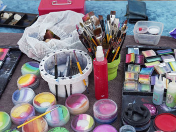 High angle view of various containers on table