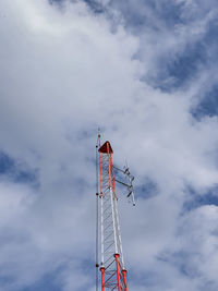 Low angle view of communications tower against sky