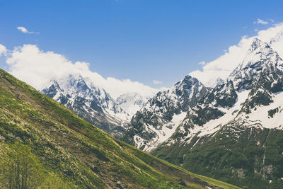 Scenic view of snowcapped mountains against sky