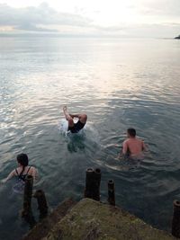 People swimming in sea