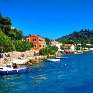 Scenic view of sea against buildings