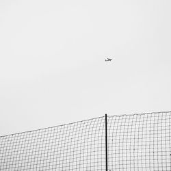 Low angle view of airplane flying in sky