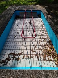 High angle view of playground by swimming pool