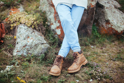 Low section of man wearing shoes