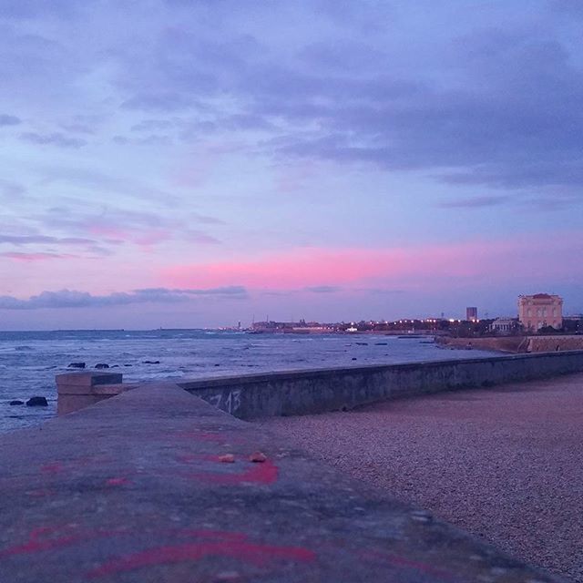 water, sky, sea, beach, cloud - sky, scenics, sunset, tranquil scene, shore, building exterior, tranquility, beauty in nature, built structure, cloud, architecture, nature, sand, cloudy, horizon over water, idyllic