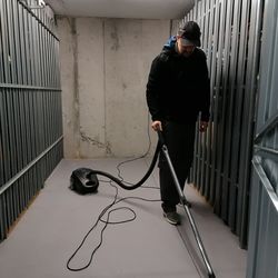 High angle view of man standing in cage