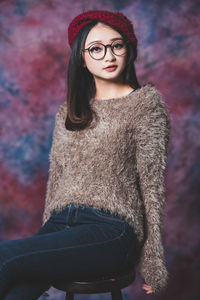 Portrait of young woman in hat