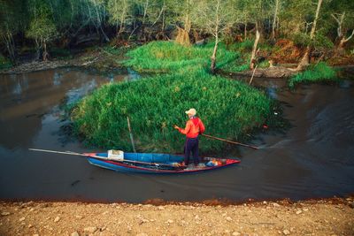 Man sailing in river