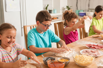 Kids preparing food at kitchen