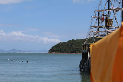 Sailboat on sea against sky