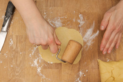 Midsection of person preparing food on table