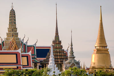 Low angle view of pagoda against buildings