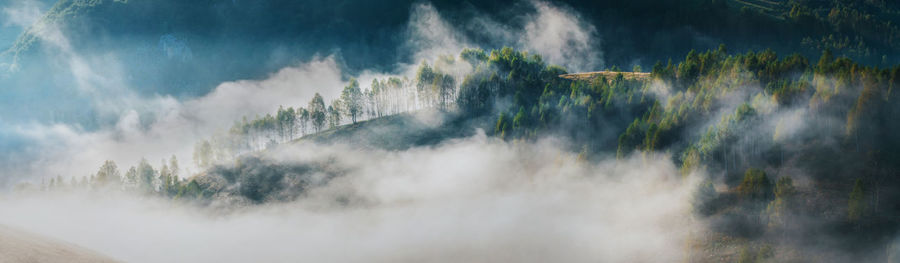 Panoramic view of waterfall against sky